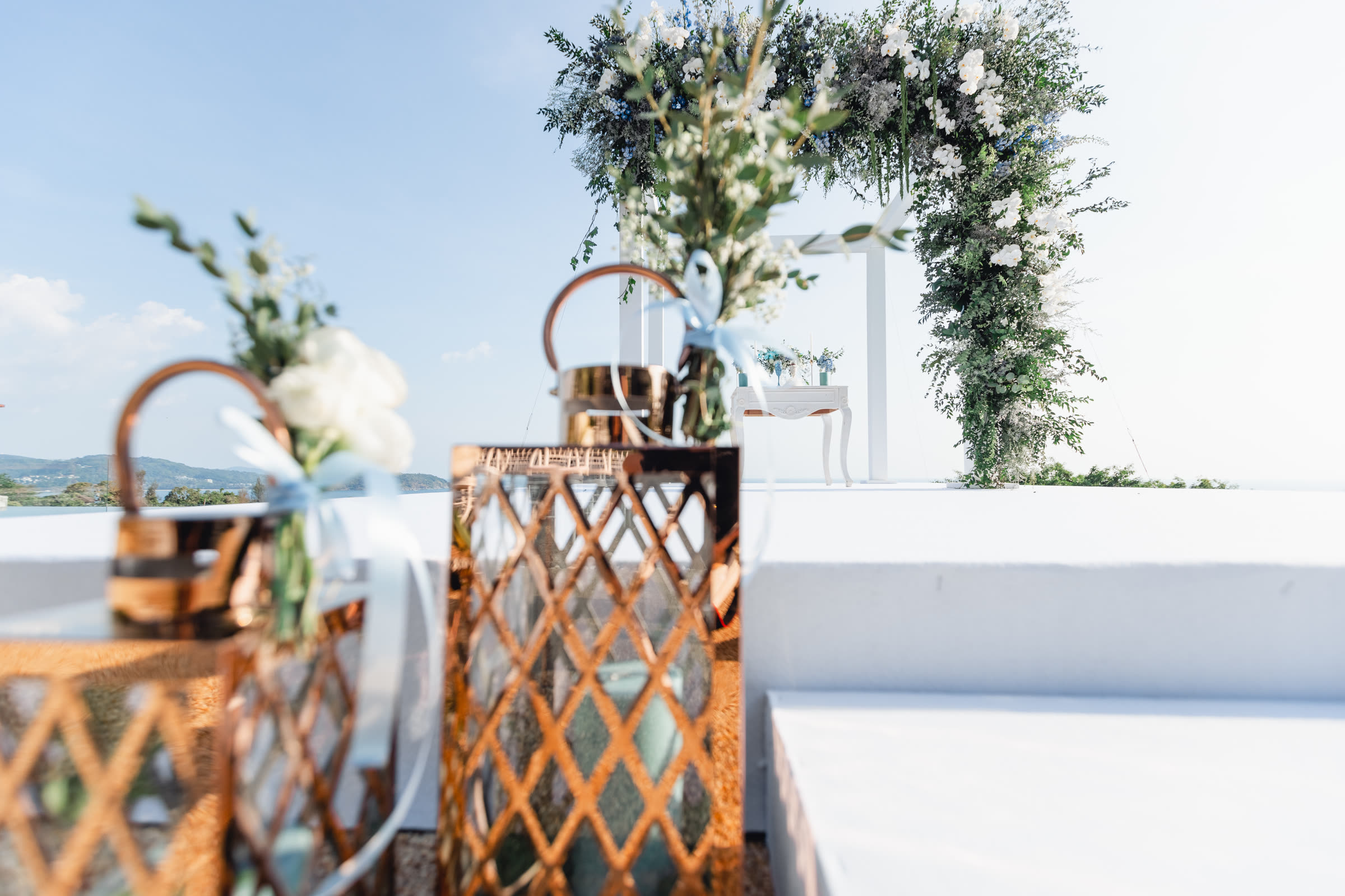 Villa Aye reception tablescape with floral runner and candlelight, designed by Wedding Flowers Phuket