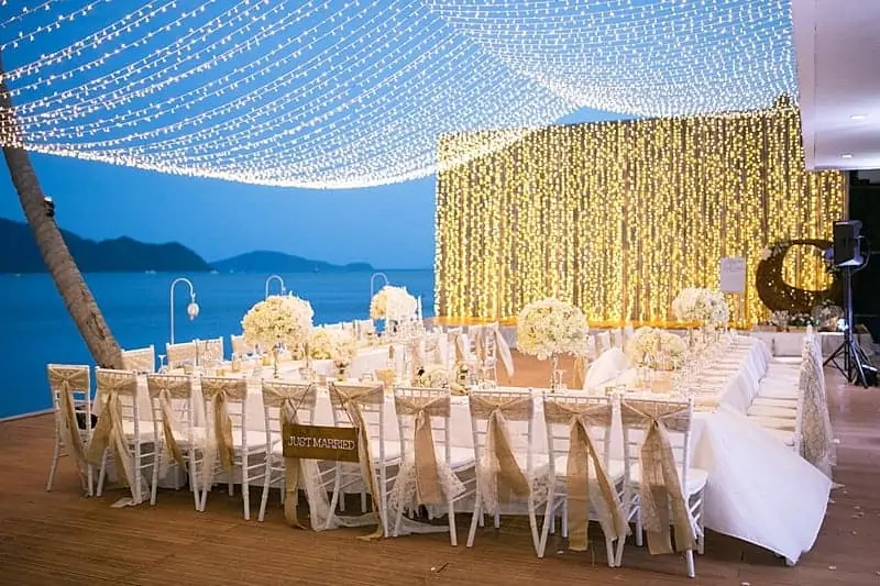 Suspended floral installation above a Phuket wedding reception, designed and rigged by Wedding Flowers Phuket