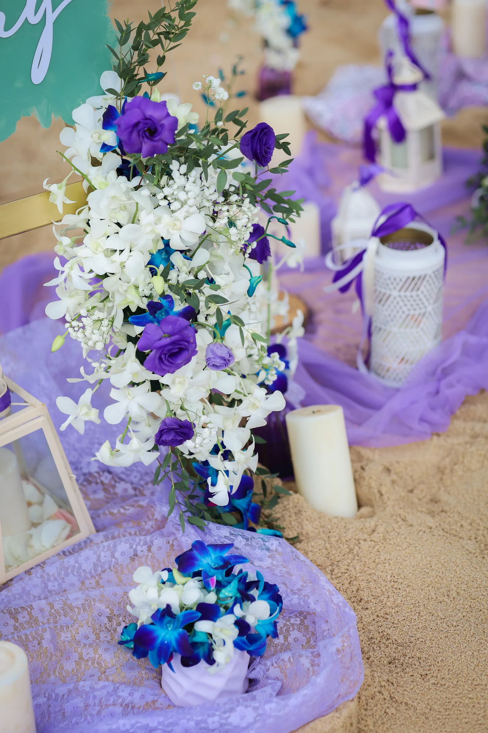 Purple, blue and white bridal bouquet with matching boutonnière by Wedding Flowers Phuket
